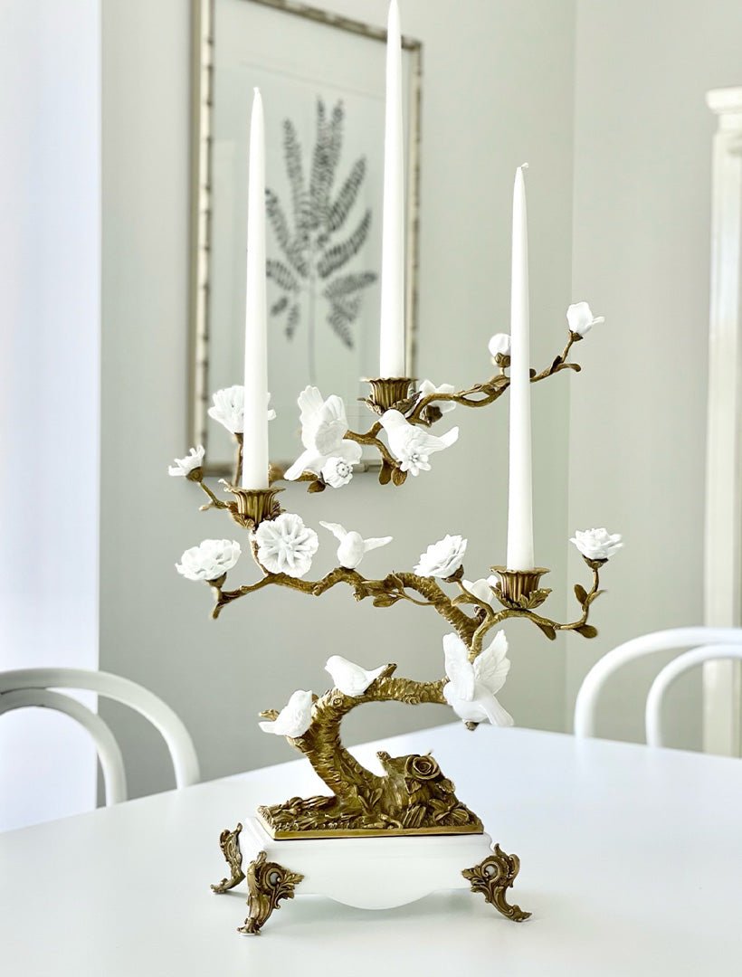 White bird candleabra with candles