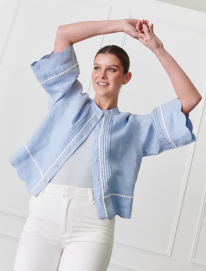 A young woman wears Zjoosh Blue lace linen shacket