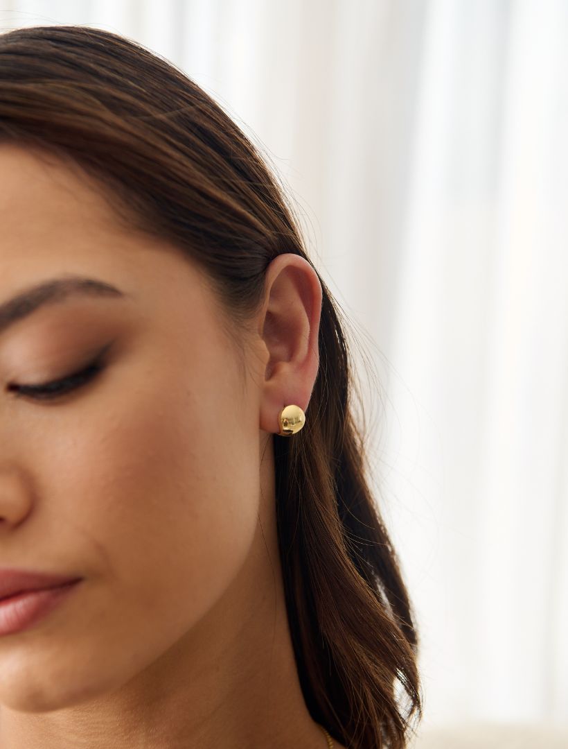 Side view - gold ball earrings