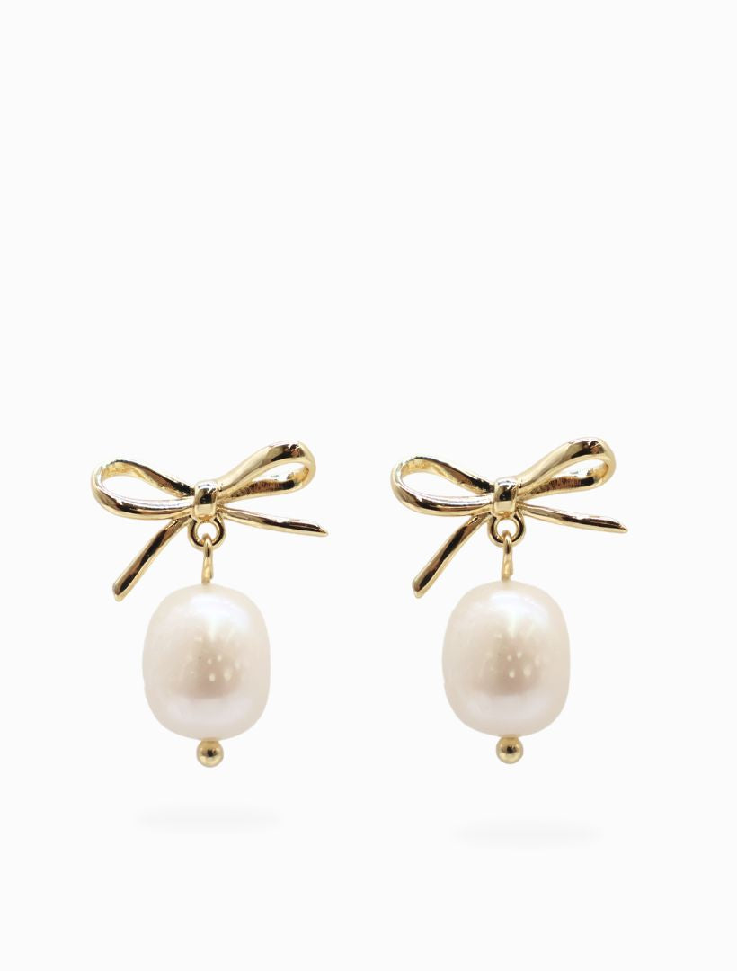 Front view - pearl gold bow drop earrings