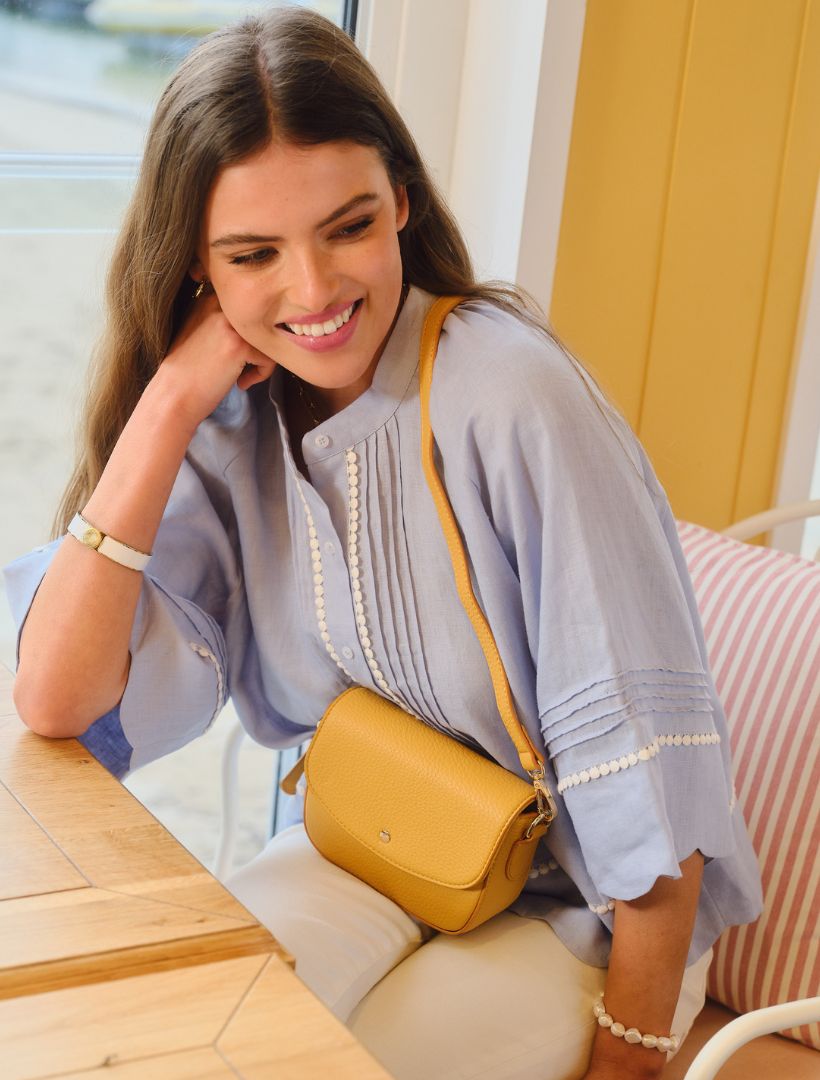 Lifestyle - yellow mini cross body bag