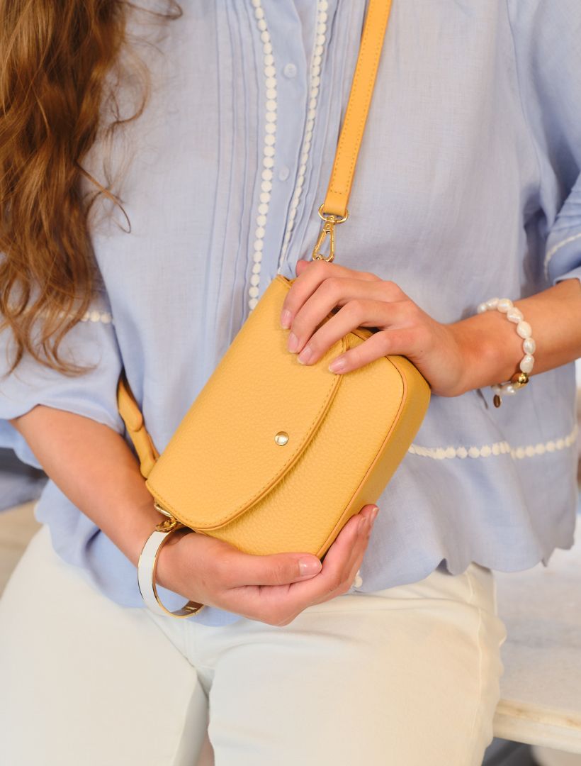 Lifestyle - yellow mini cross body bag