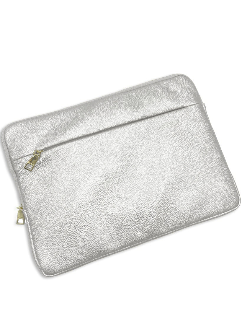 Side view - Silver laptop cover with gold hardware