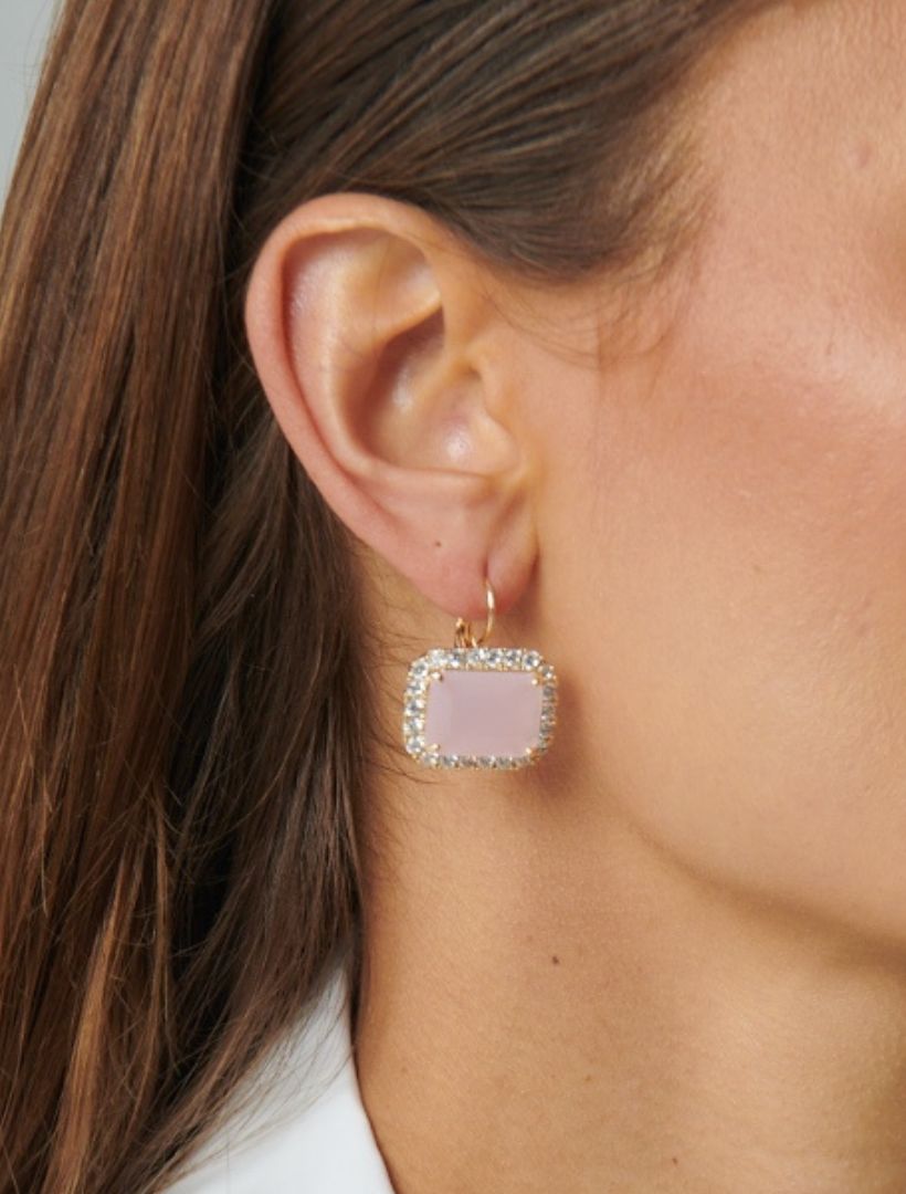 Model wearing gold hook earring with pale pink centre stone and crystal surrounding stones - zjoosh