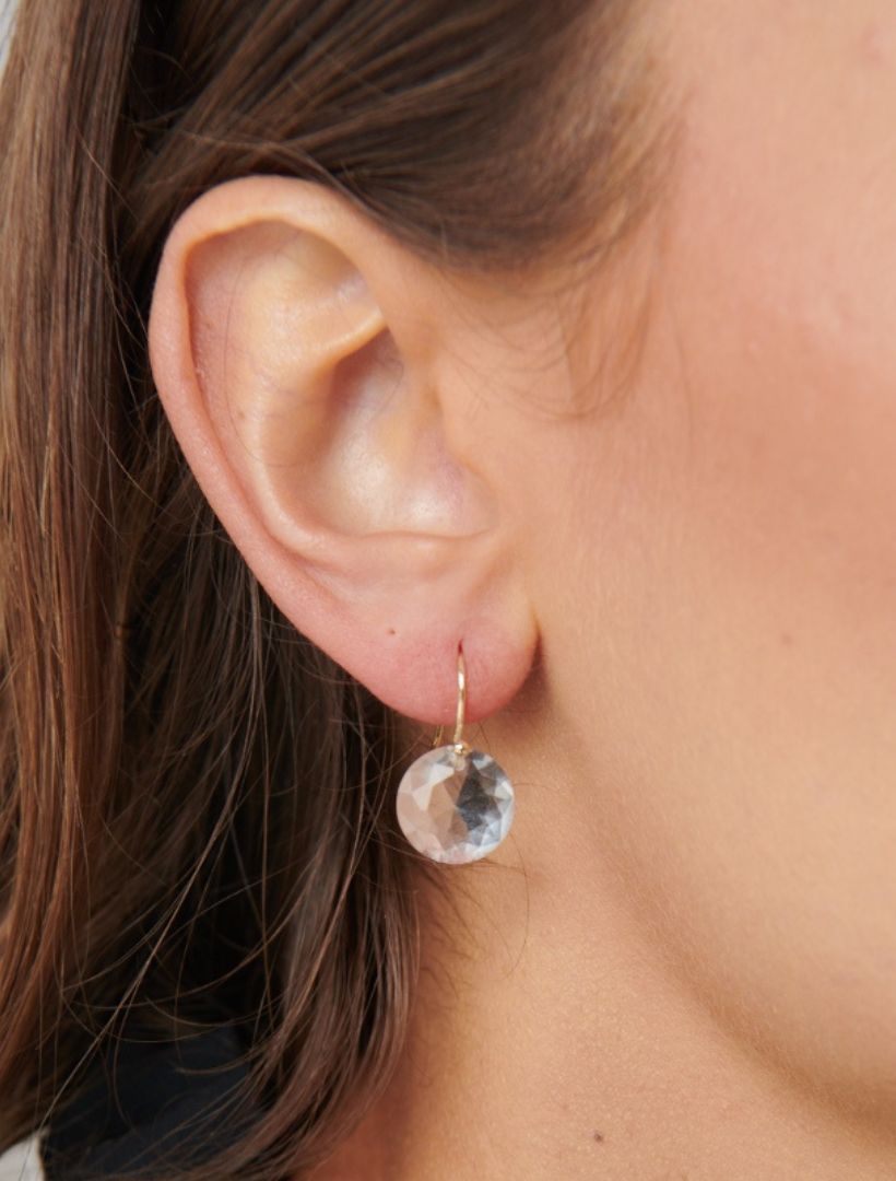 model wearing gold hook earring with white glass drop gem - zjoosh