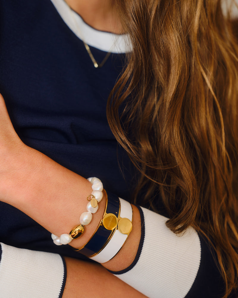 Closeup image of woman wearing 3 bracelets new fashion arrivals.