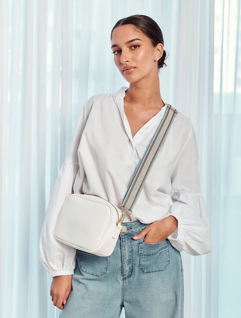 model wearing white cross body bag from zjoosh