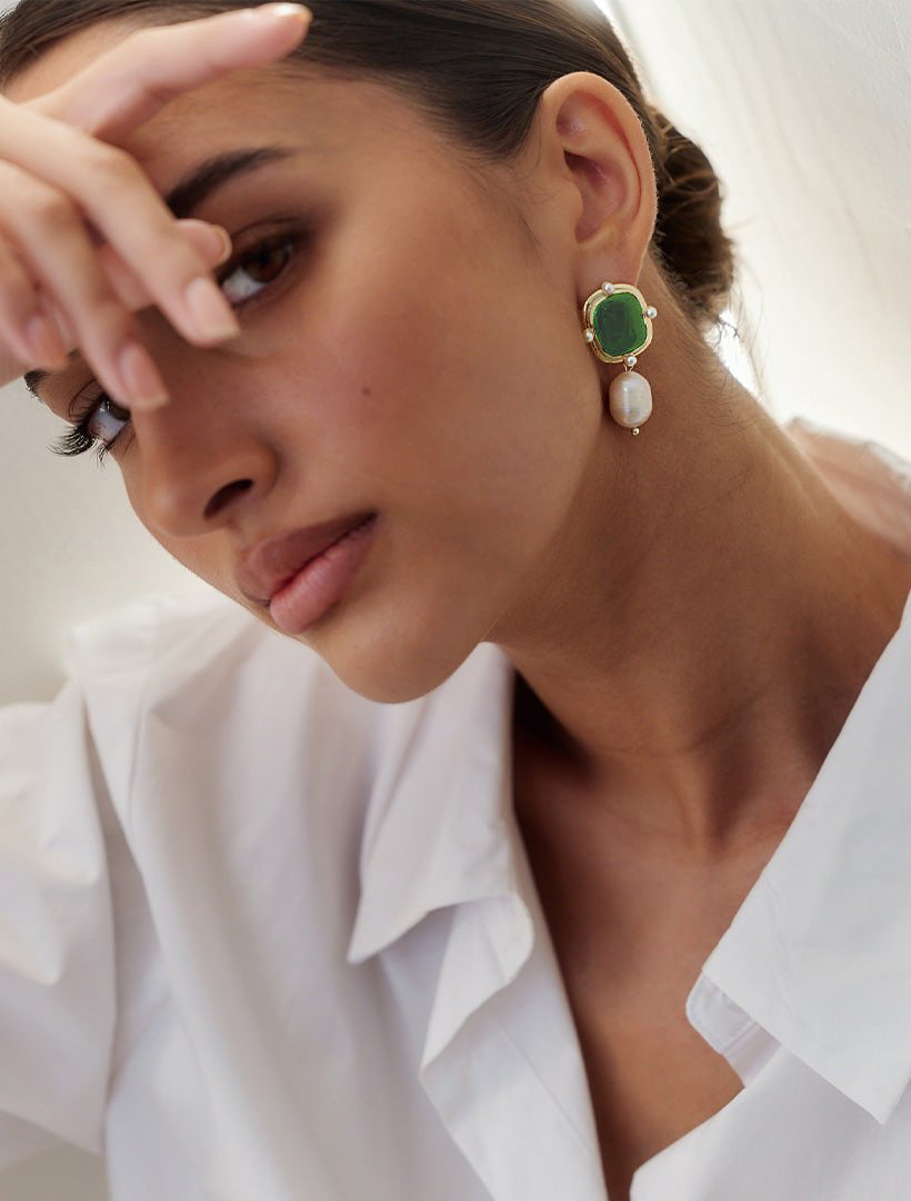 Model wearing Zjoosh earrings - green stone and pearl drop earrings